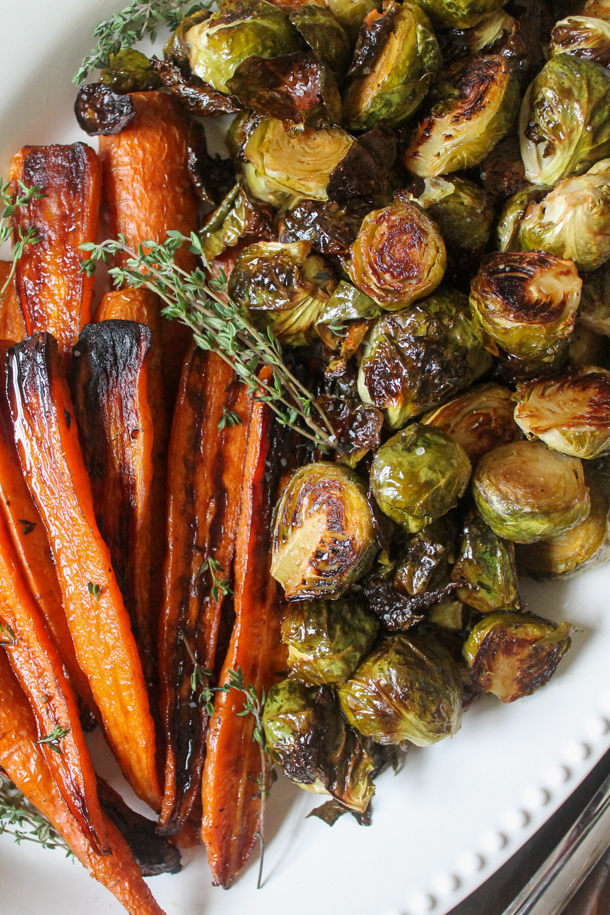 A platter of honey roasted Brussel sprouts and carrots.