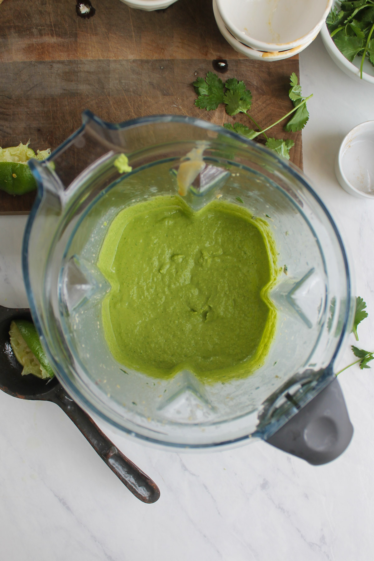 The blended green cilantro lime hummus in the blender.