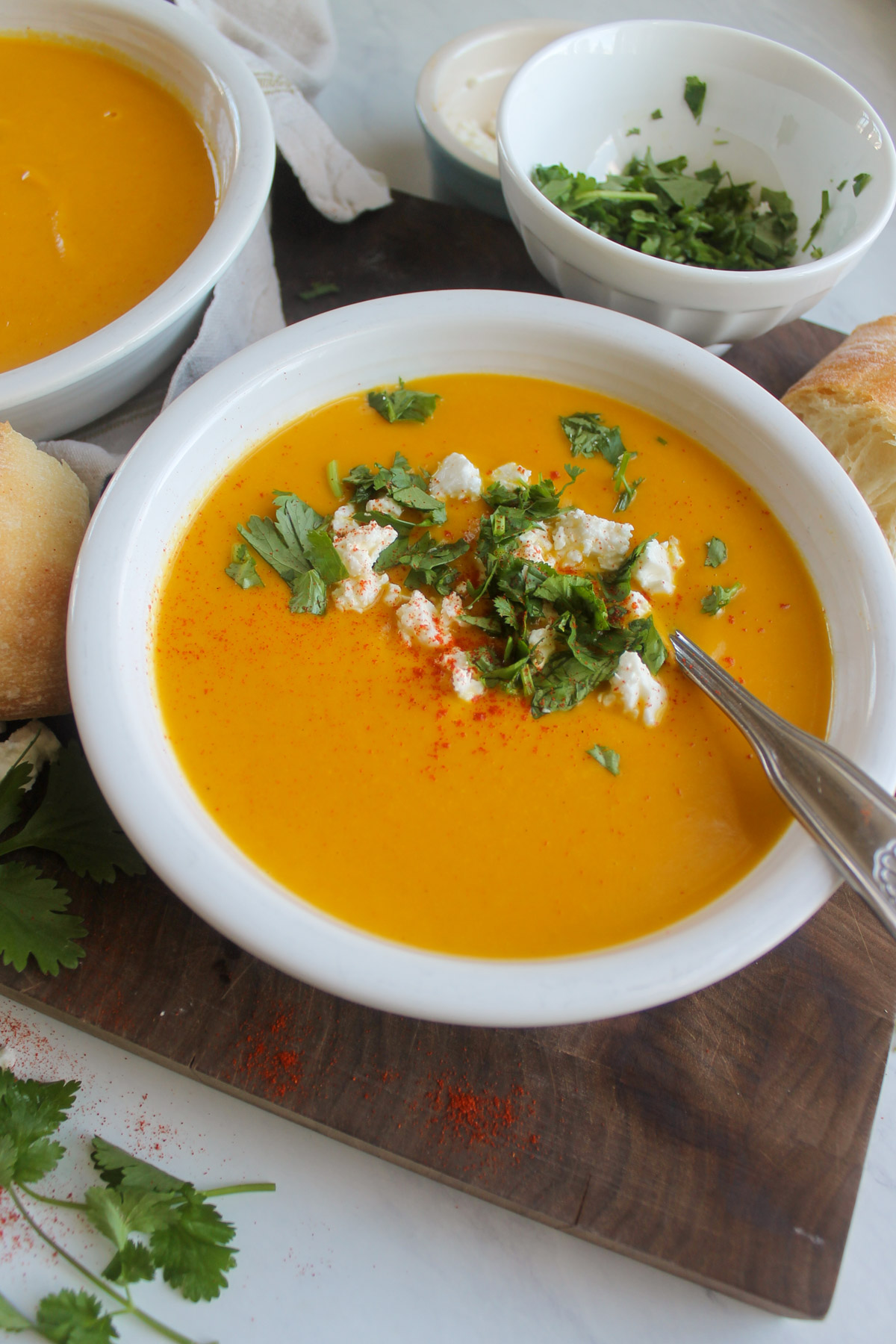 Carrot ginger soup with coconut milk and topped with feta cheese and cilantro.