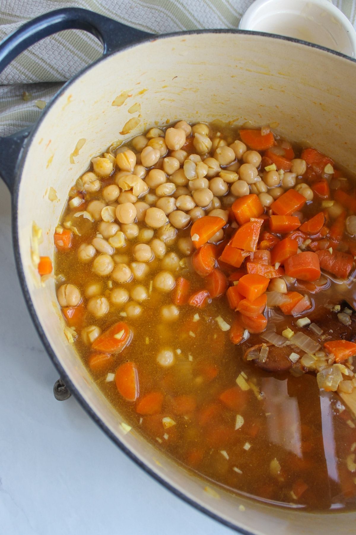 The carrot ginger soup with the chickpeas and vegetable stock added.