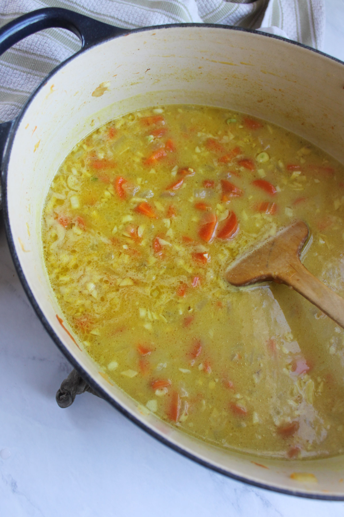 Carrot ginger coconut soup simmering before it is blended.