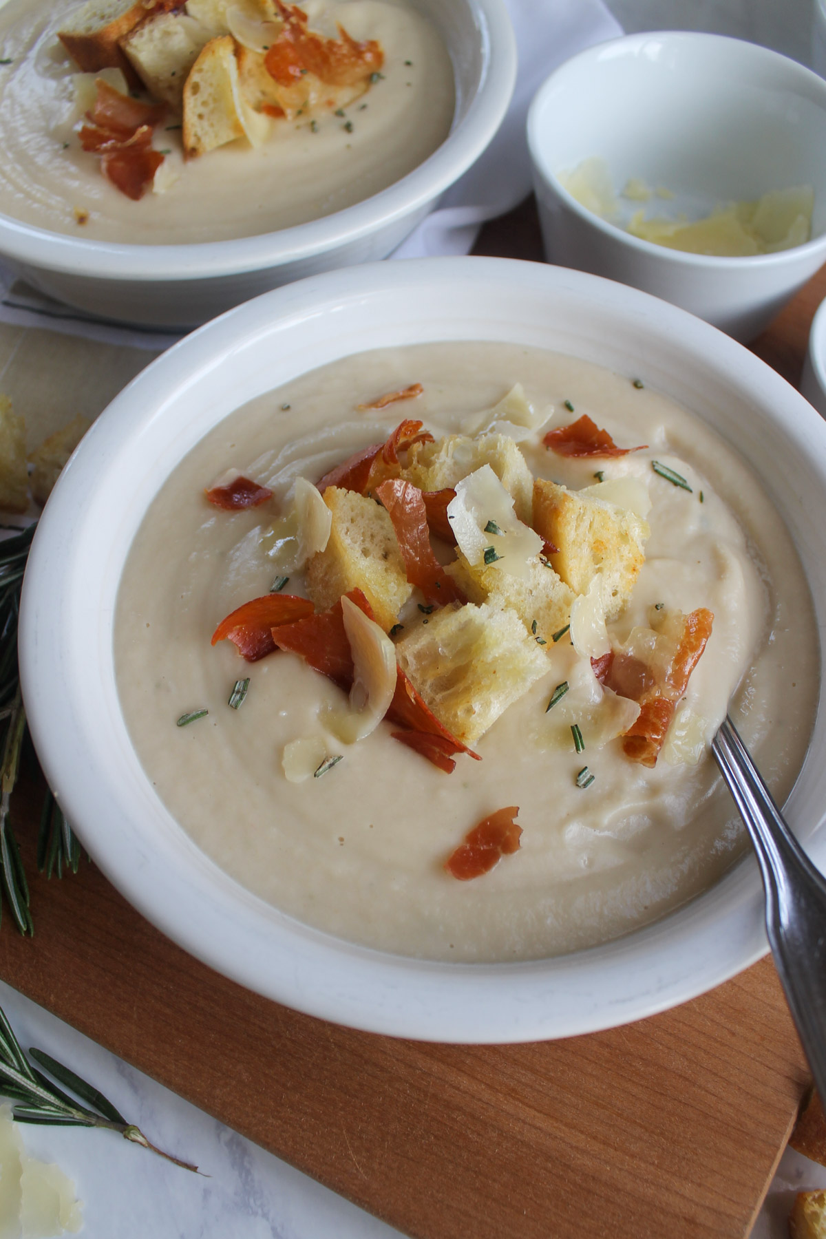 Cauliflower and white bean soup with fresh rosemary and Parmesan cheese.
