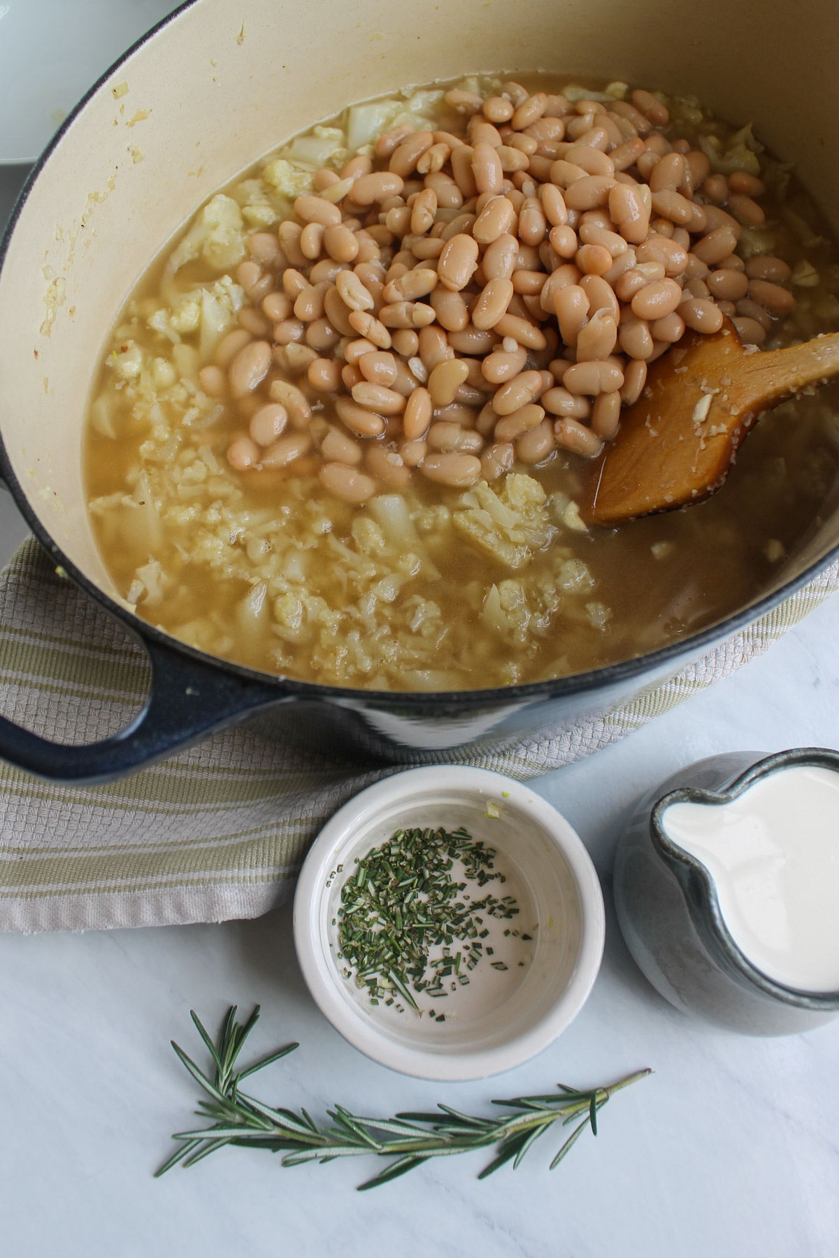 The beans and stock added to the cauliflower soup.