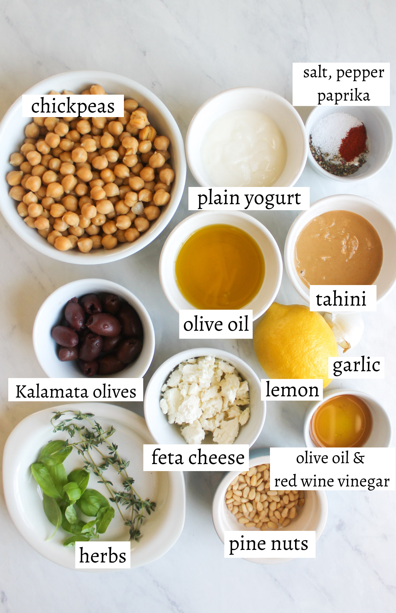 Labeled ingredients for Mediterranean Hummus with Olives and Feta Cheese.