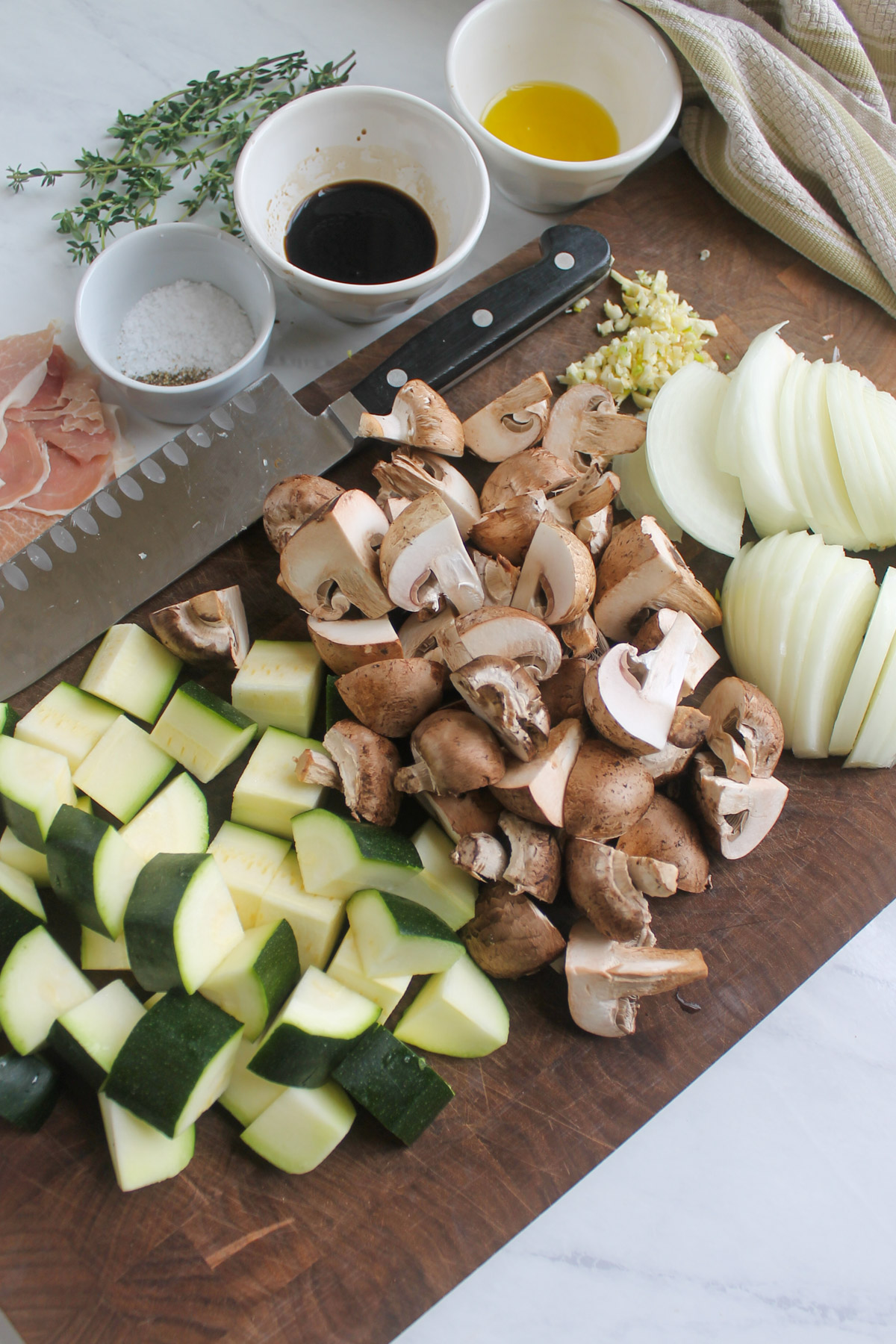 Prepped vegetables chopped on a cutting board.