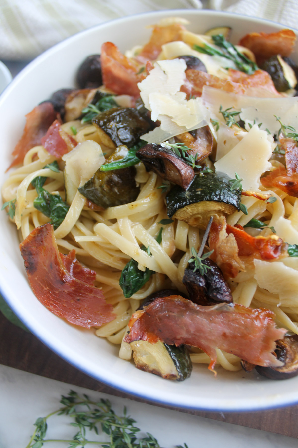 Mushroom and zucchini pasta with crispy prosciutto and thyme.