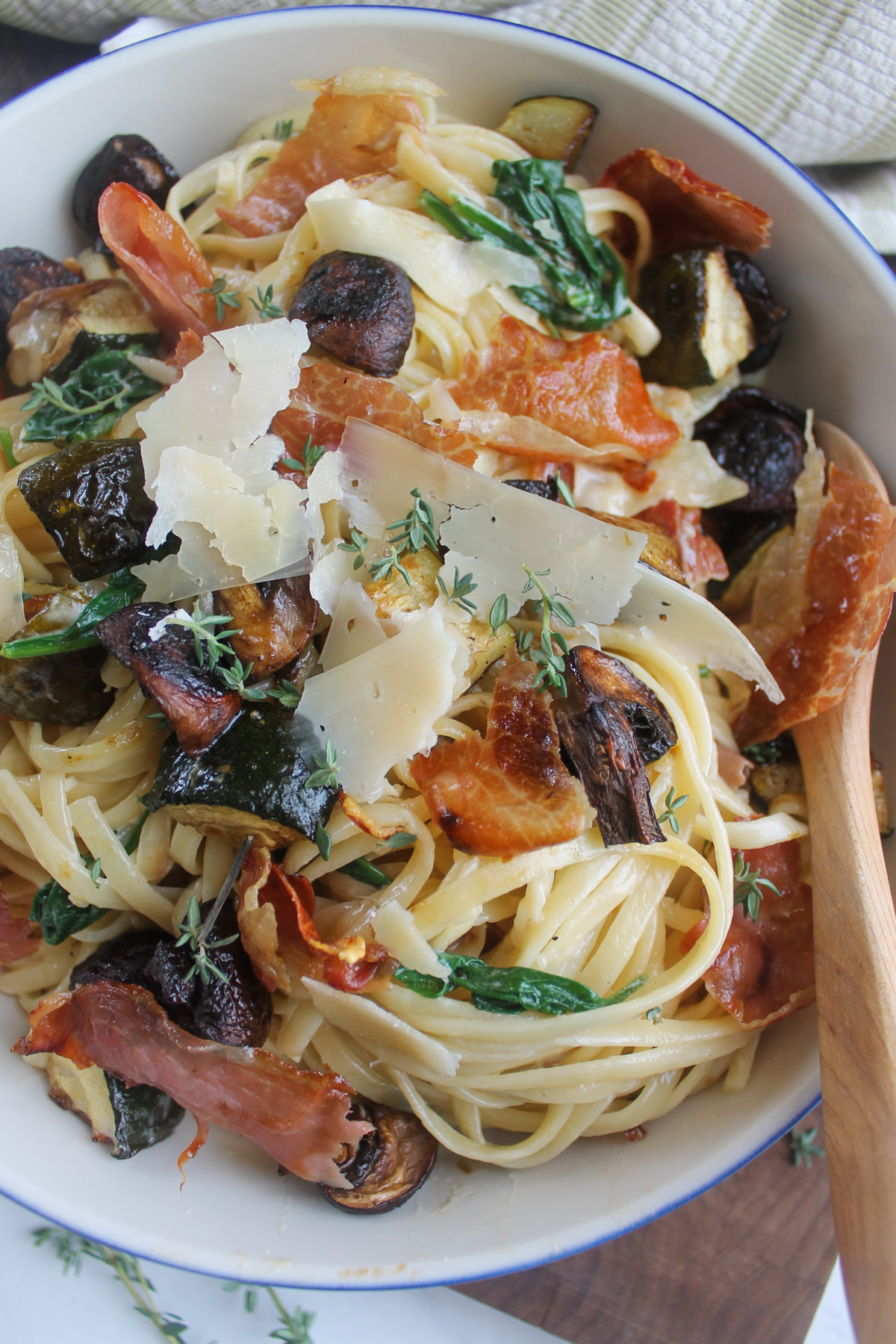 Mushroom zucchini pasta in caramelized onion cream sauce with spinach.