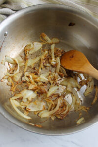 Onions caramelized in a skillet as a base for the cream sauce.