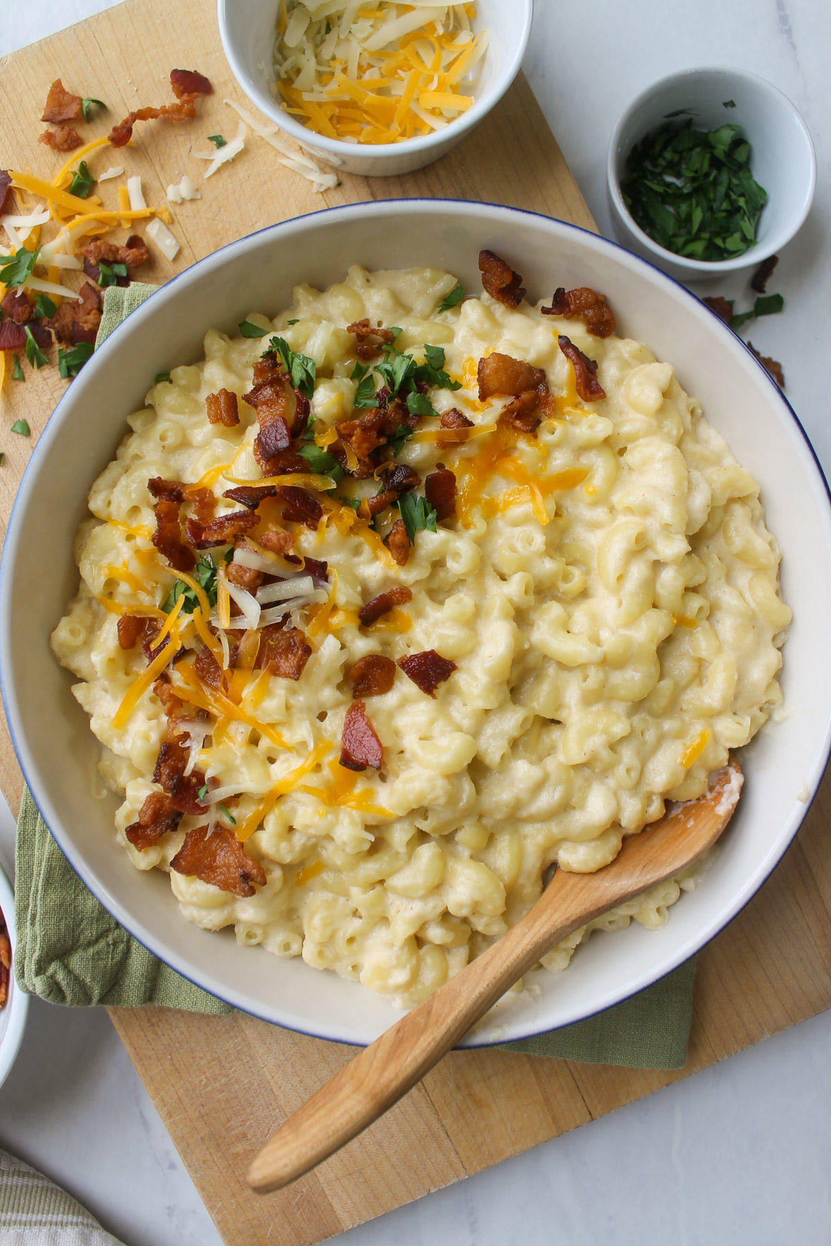 A white bowl of bacon cauliflower mac and cheese.