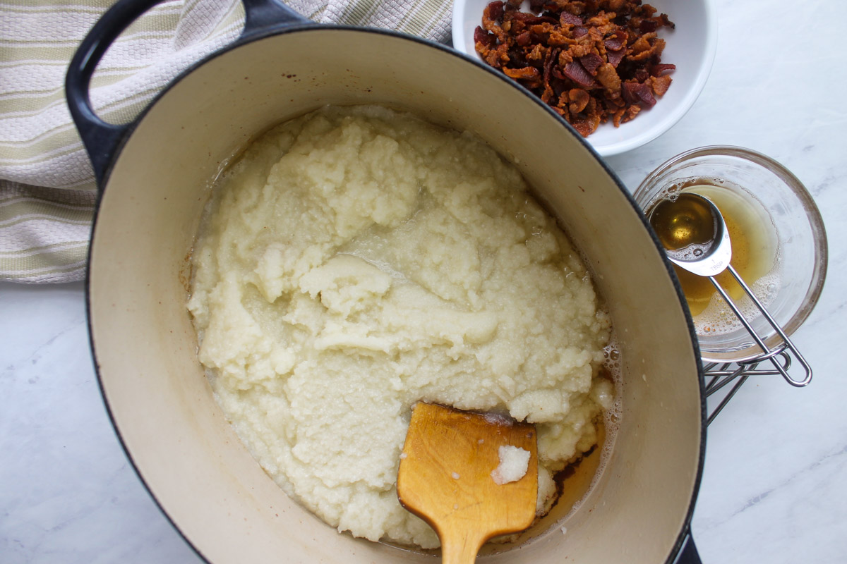 Adding cauliflower puree to saute in the bacon fat.