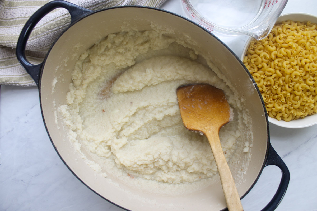 Adding garlic, flour and salt to the cauliflower puree.