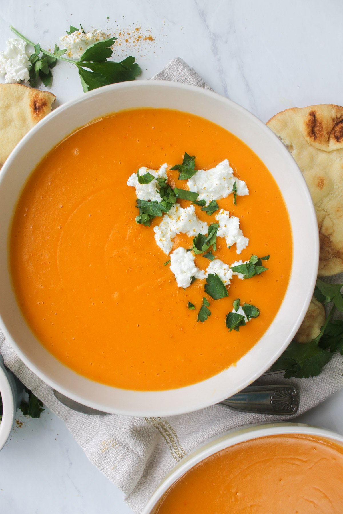 Red pepper and butternut squash soup with warmed naan for dipping.