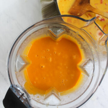 A blender full of butternut squash ginger soup.
