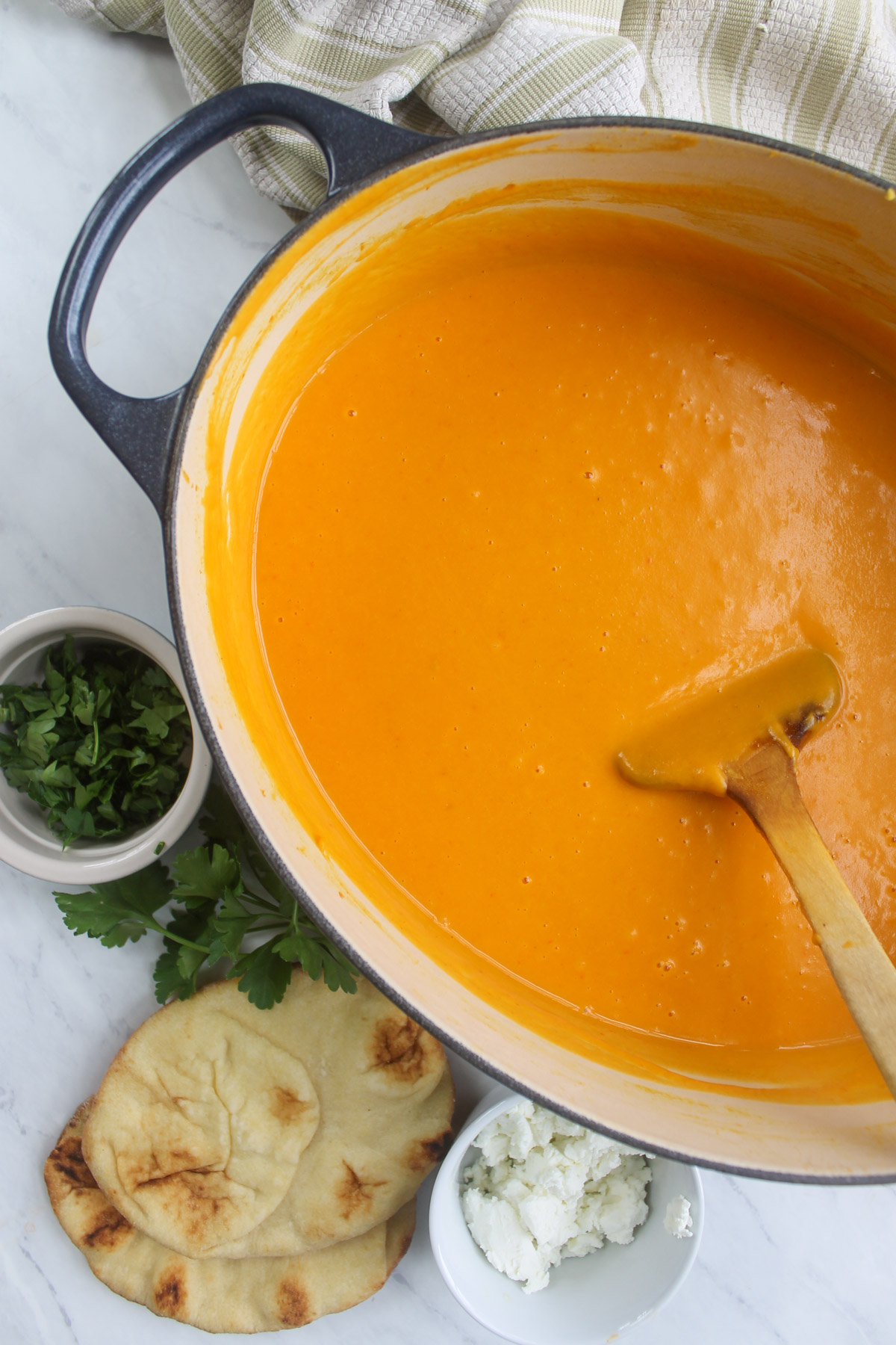 A large pot of pureed butternut squash and pepper soup.