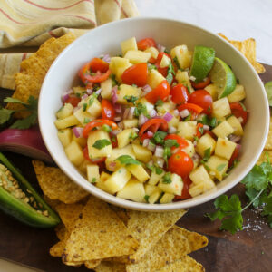 Pineapple pico de gallo salsa with cherry tomatoes.