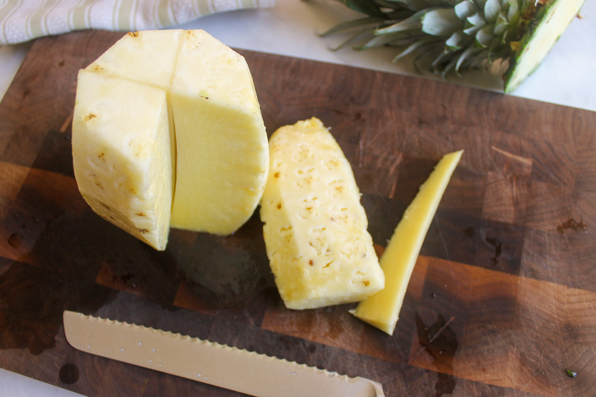 Removing the core from a fresh pineapple.