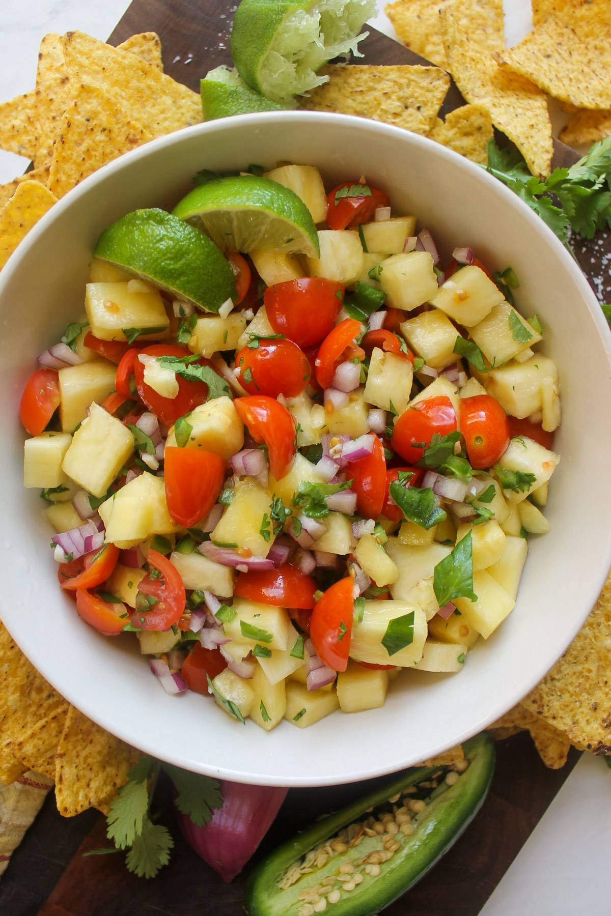 Pineapple pico de gallo salsa in a bowl for snacking with chips.
