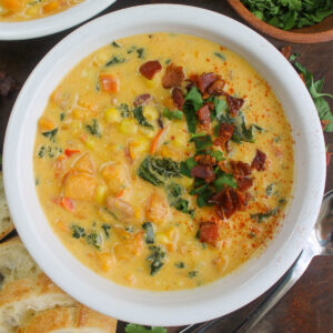 Sweet potato corn and kale chowder with crusty bread on the side to dip.