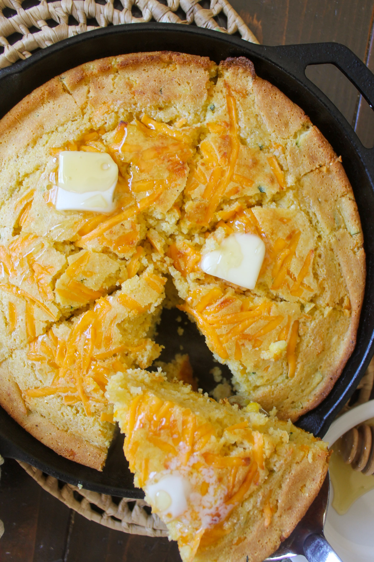 Honey skillet cornbread cut into slices.