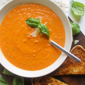 A bowl of garden roasted tomato soup with fresh basil.