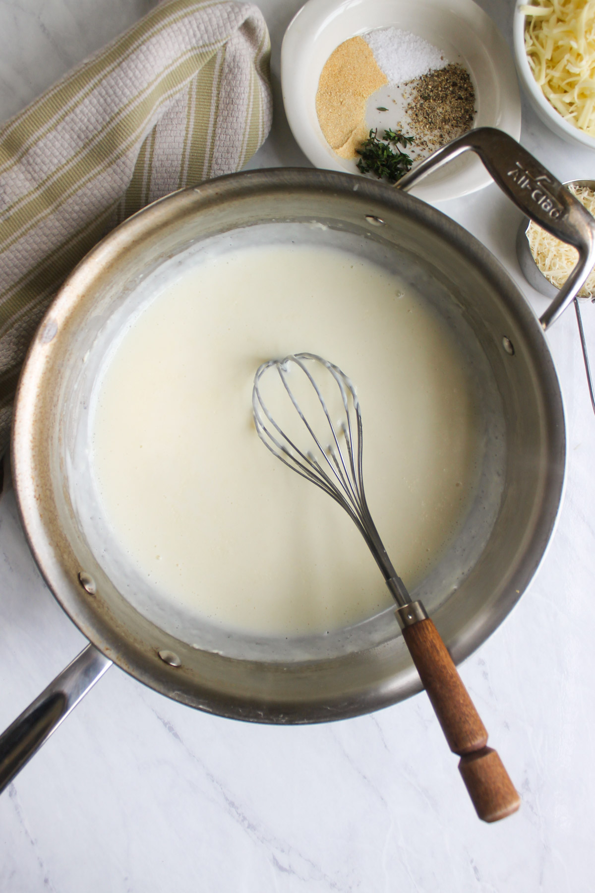 A skillet of bechamel white sauce.