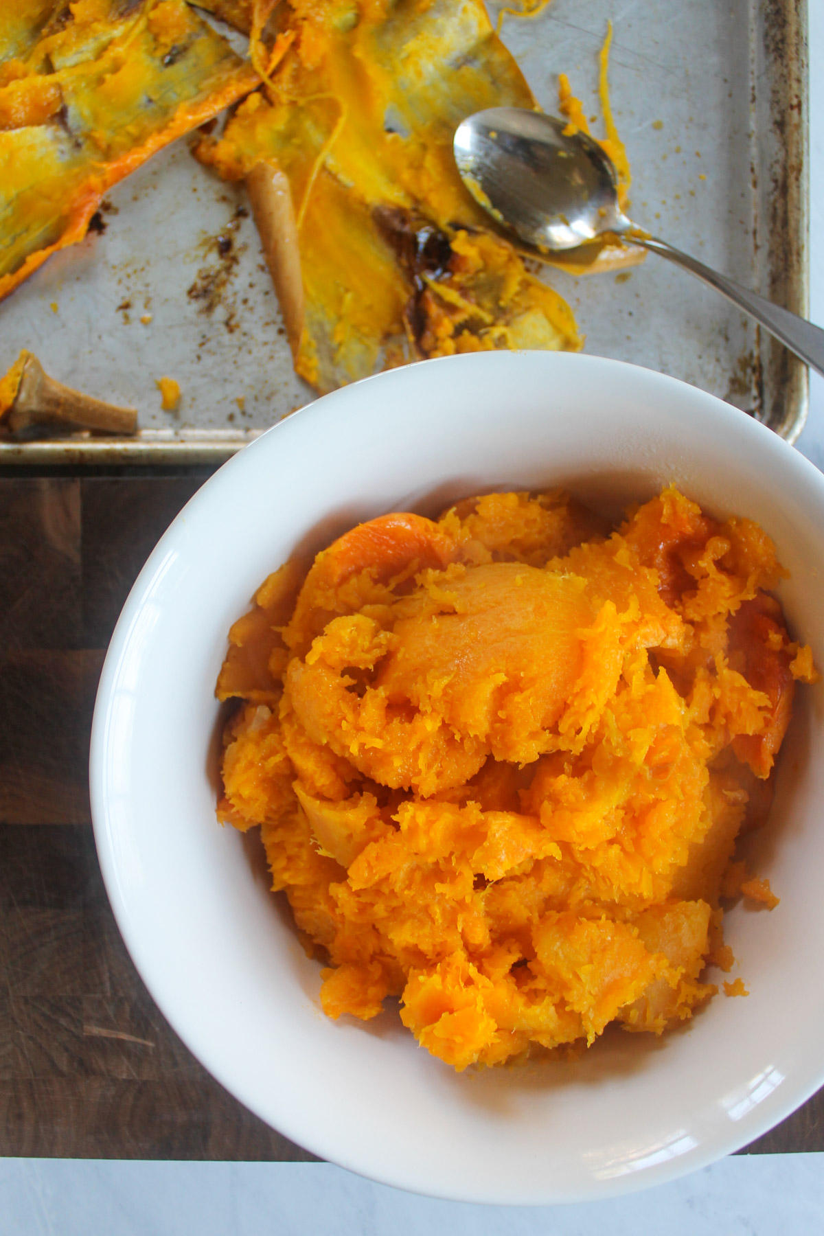 A bowl of butternut squash scooped from the roasted peels.