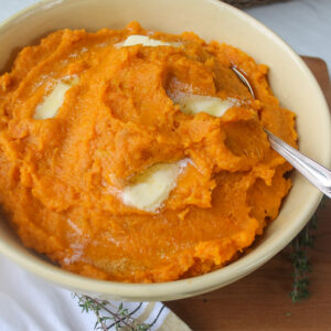 A bowl of buttery maple mashed sweet potatoes.