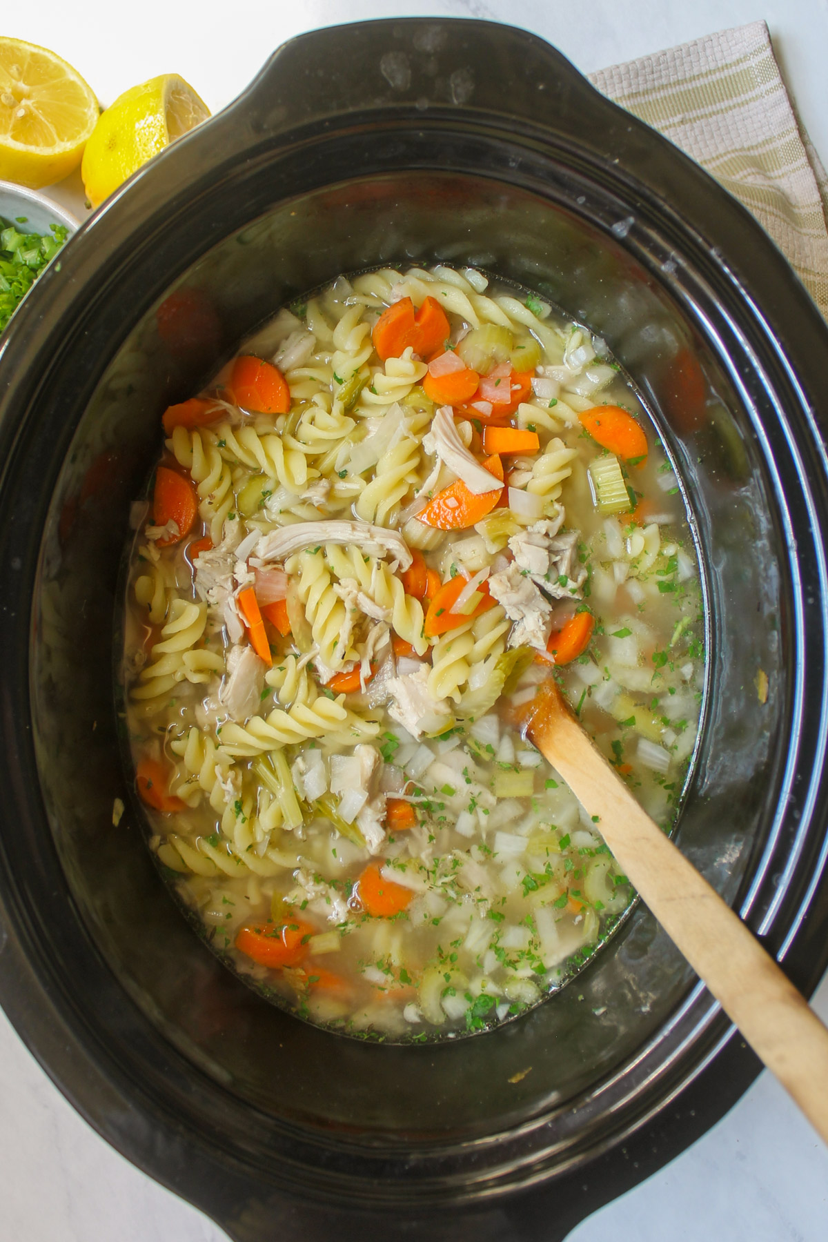 Chicken noodle soup in a slow cooker.