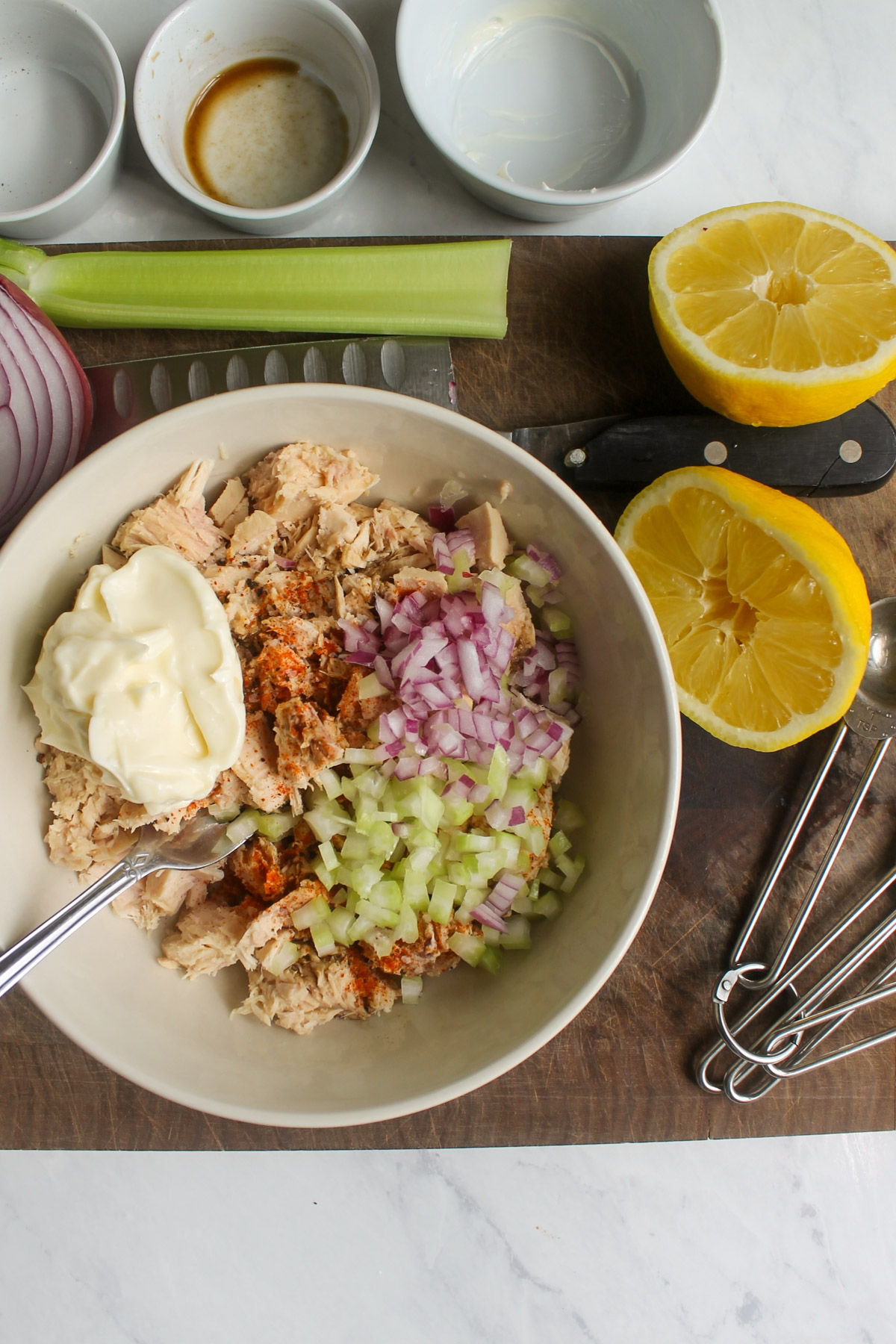 All ingredients for Tuna Salad in a bowl ready to mix.