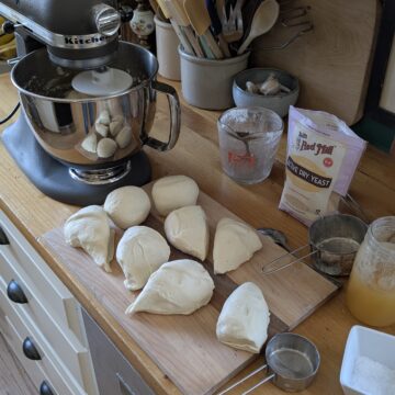 Making pizza dough in a stand mixer.