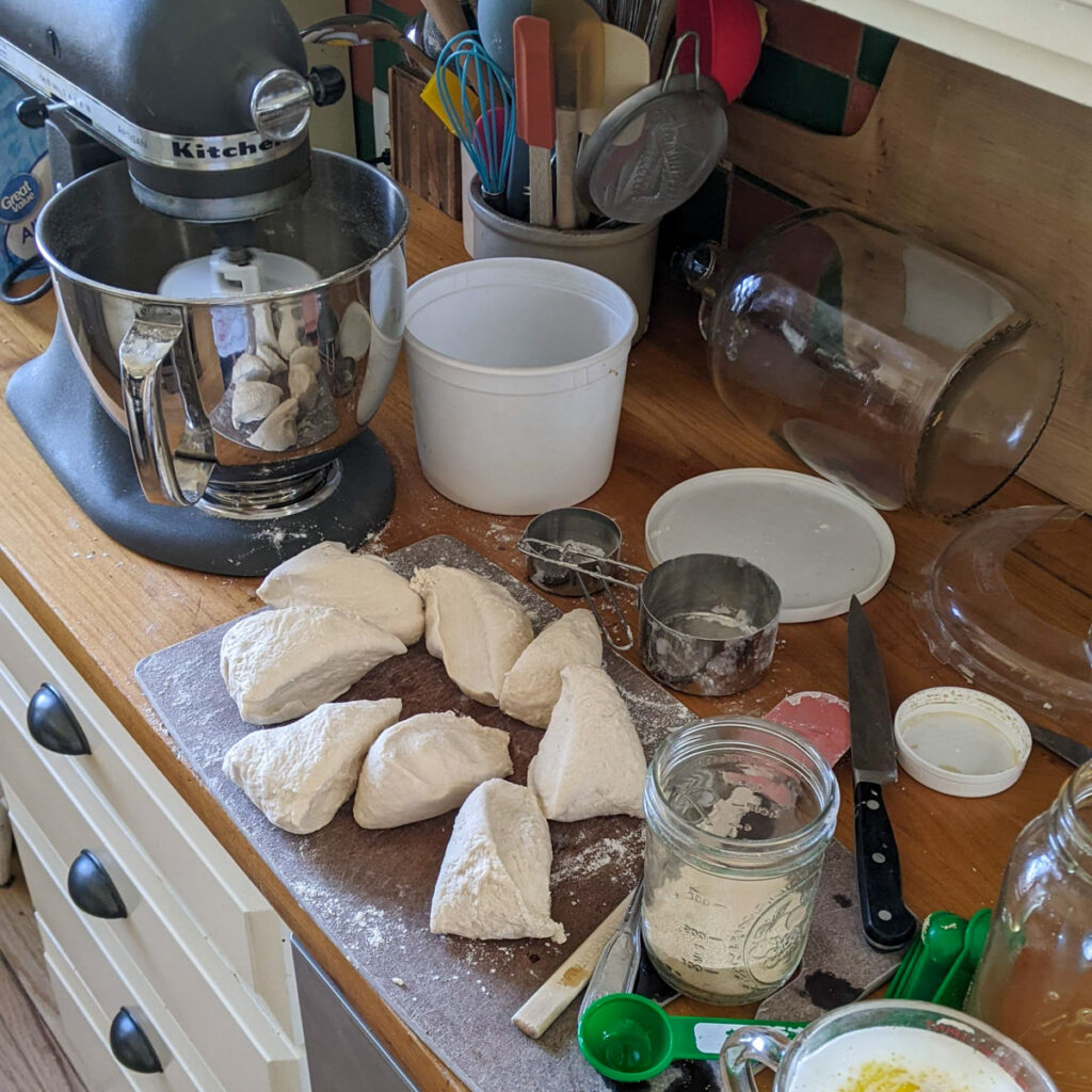 Making pizza dough with a mixer.