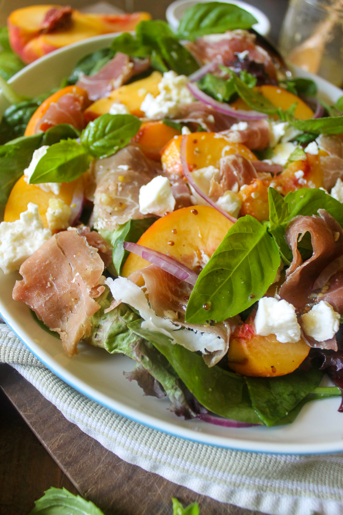 Peach salad with prosciutto and honey dressing.