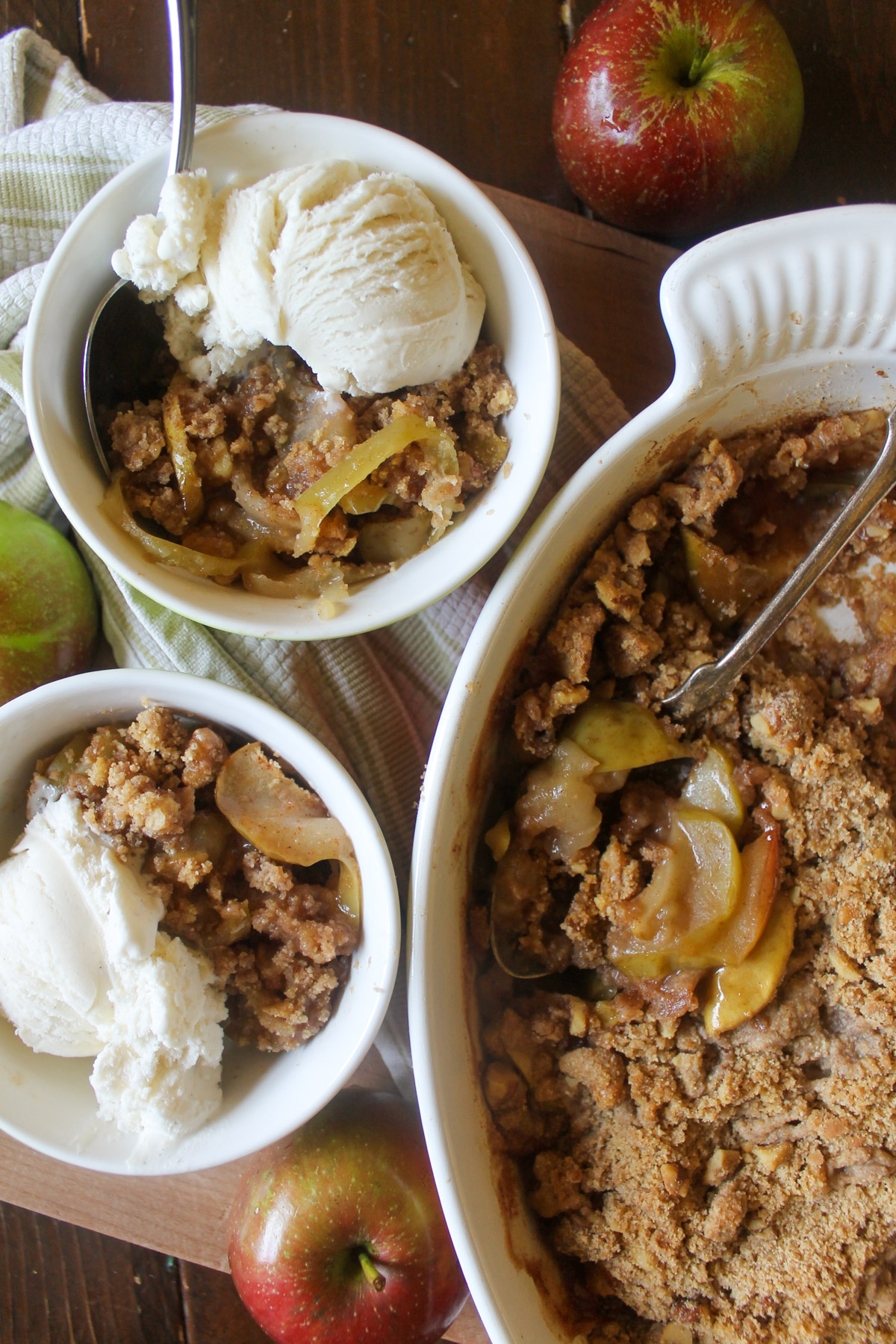 Apple crisp in a dish and bowl with ice cream.