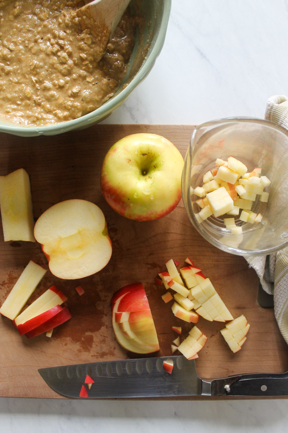Chopping apples on a cutting board.