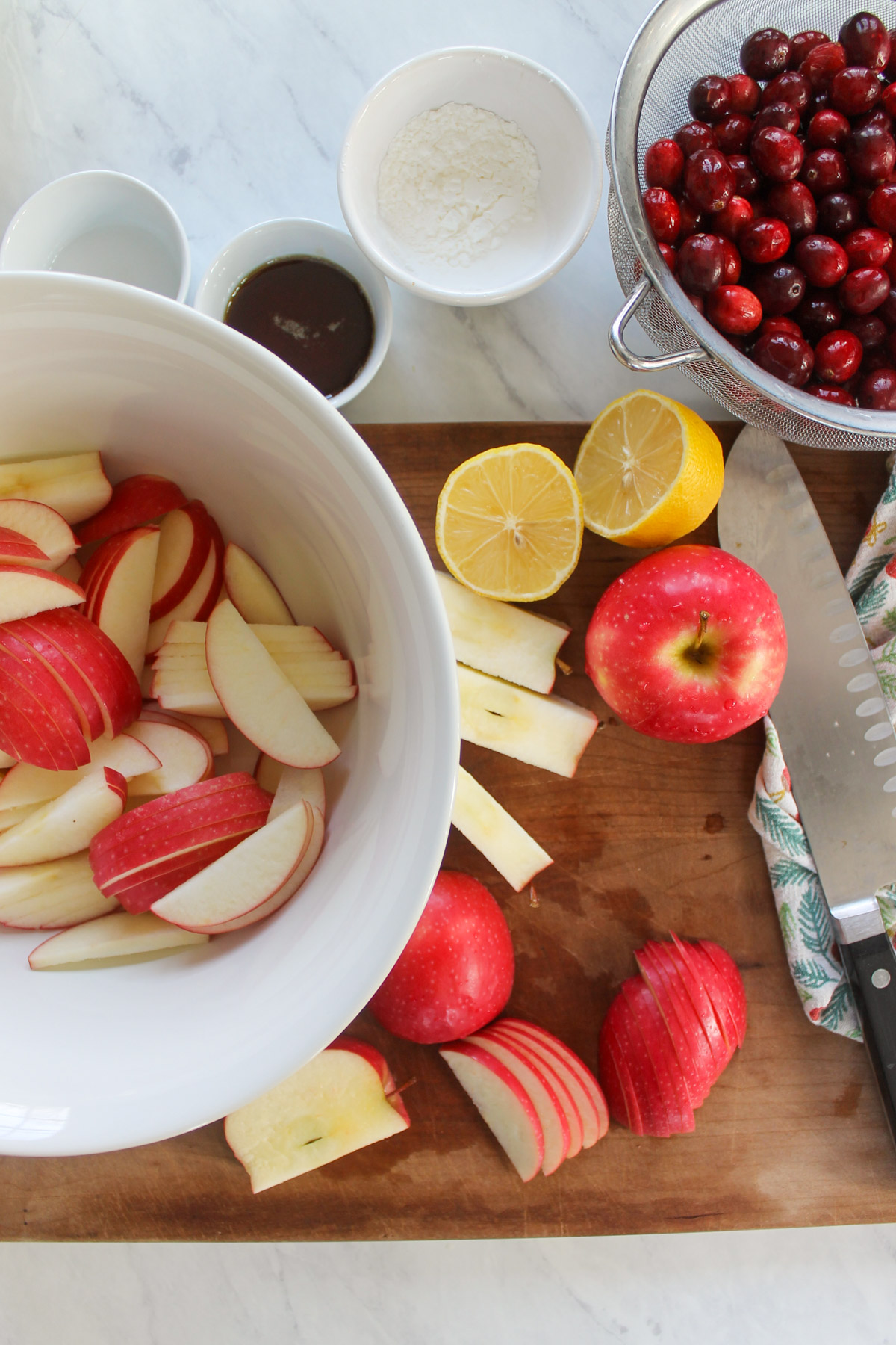Slicing apples on a cutting board and in a mixing bowl.