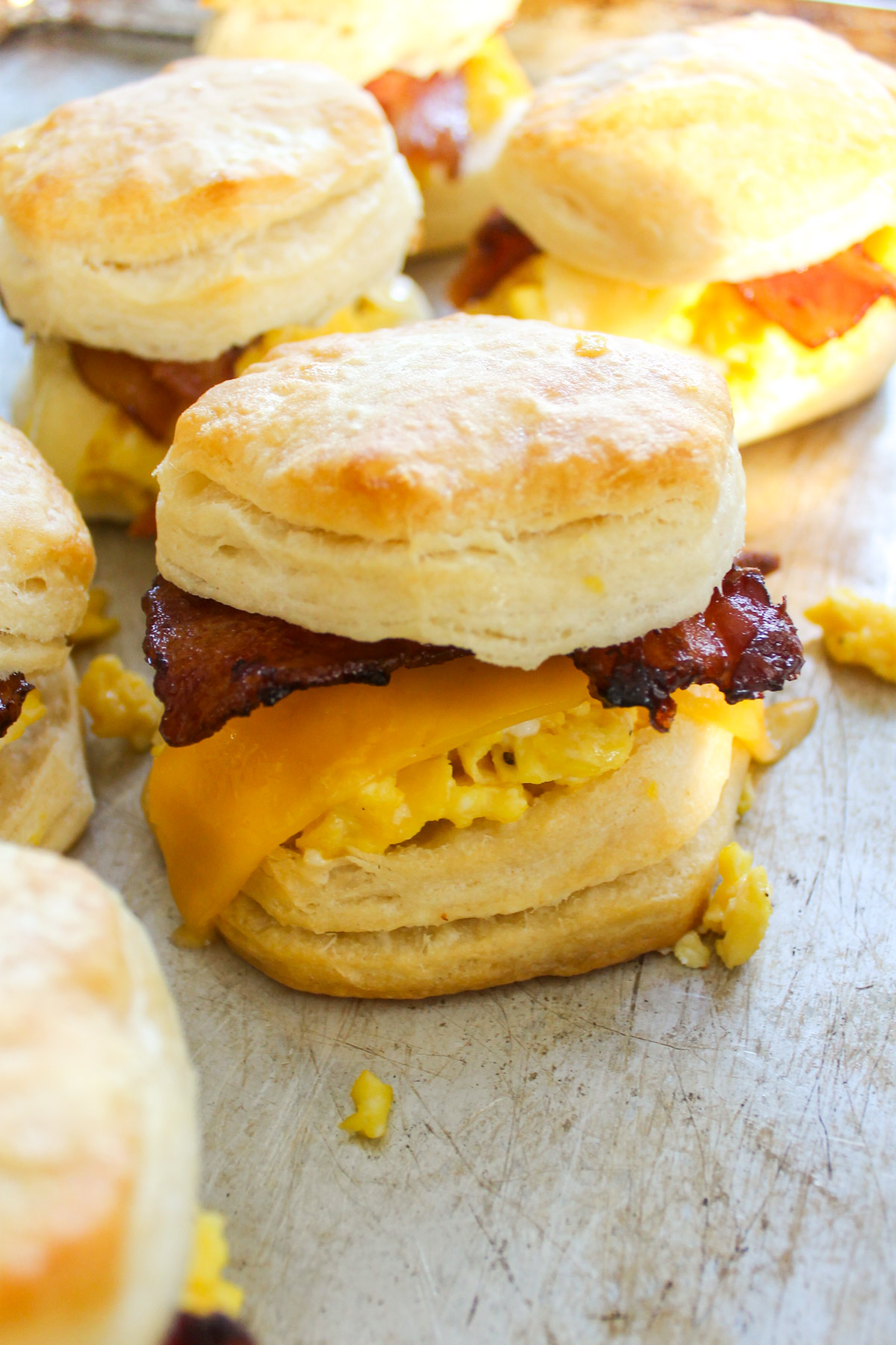 Bacon Egg and Cheese Biscuit Sandwiches on a sheet pan.