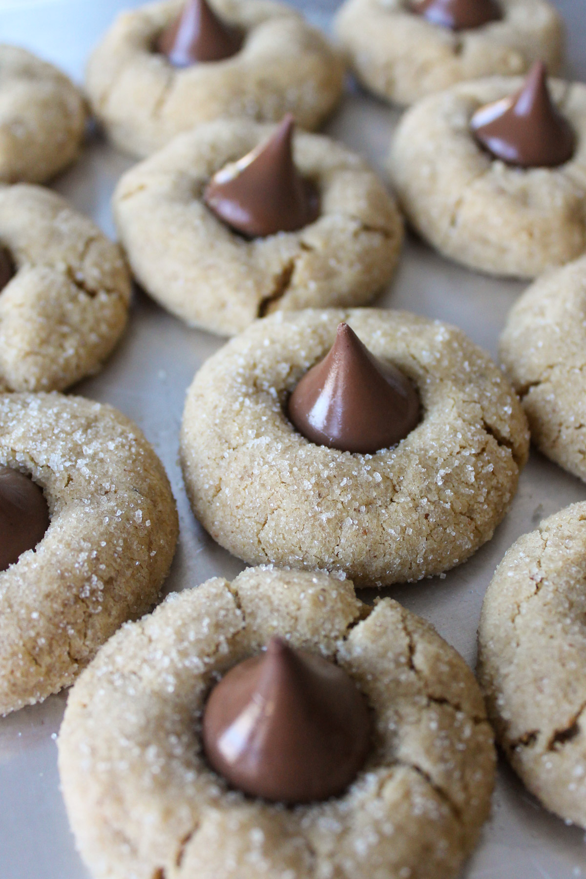 Peanut Butter Blossoms with almond flour on a cookie sheet.