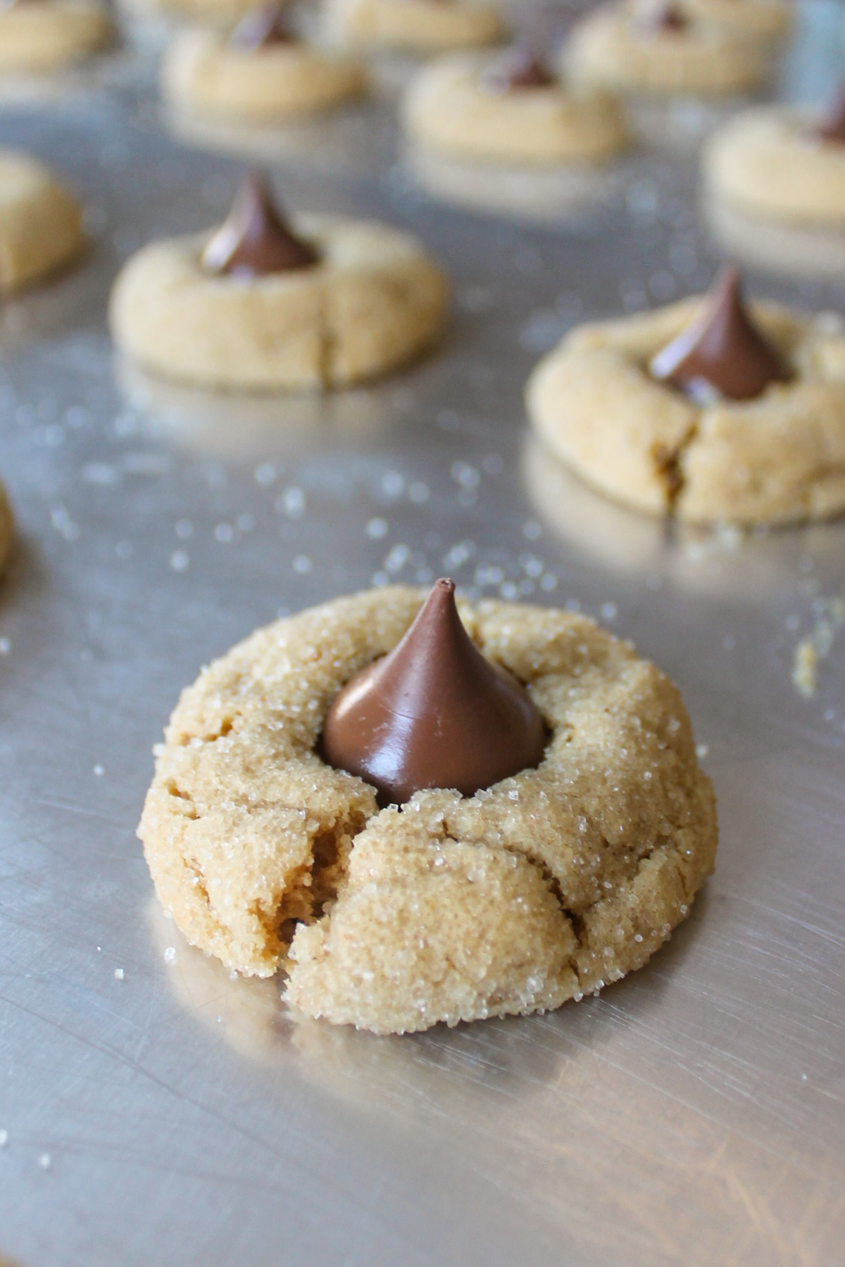 Hershey kiss cookies on a sheet pan.