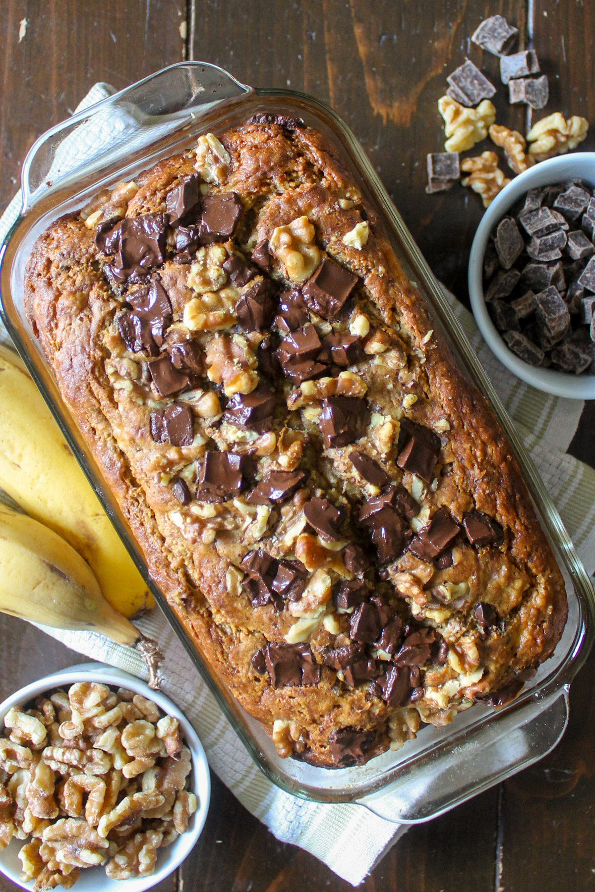 A loaf of chocolate chunk banana bread with nuts.