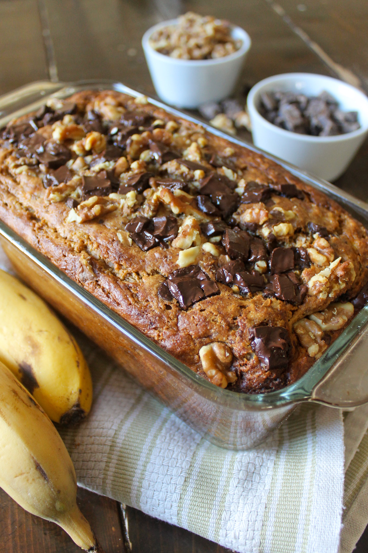 Protein banana bread topped with walnuts and chocolate chunks.