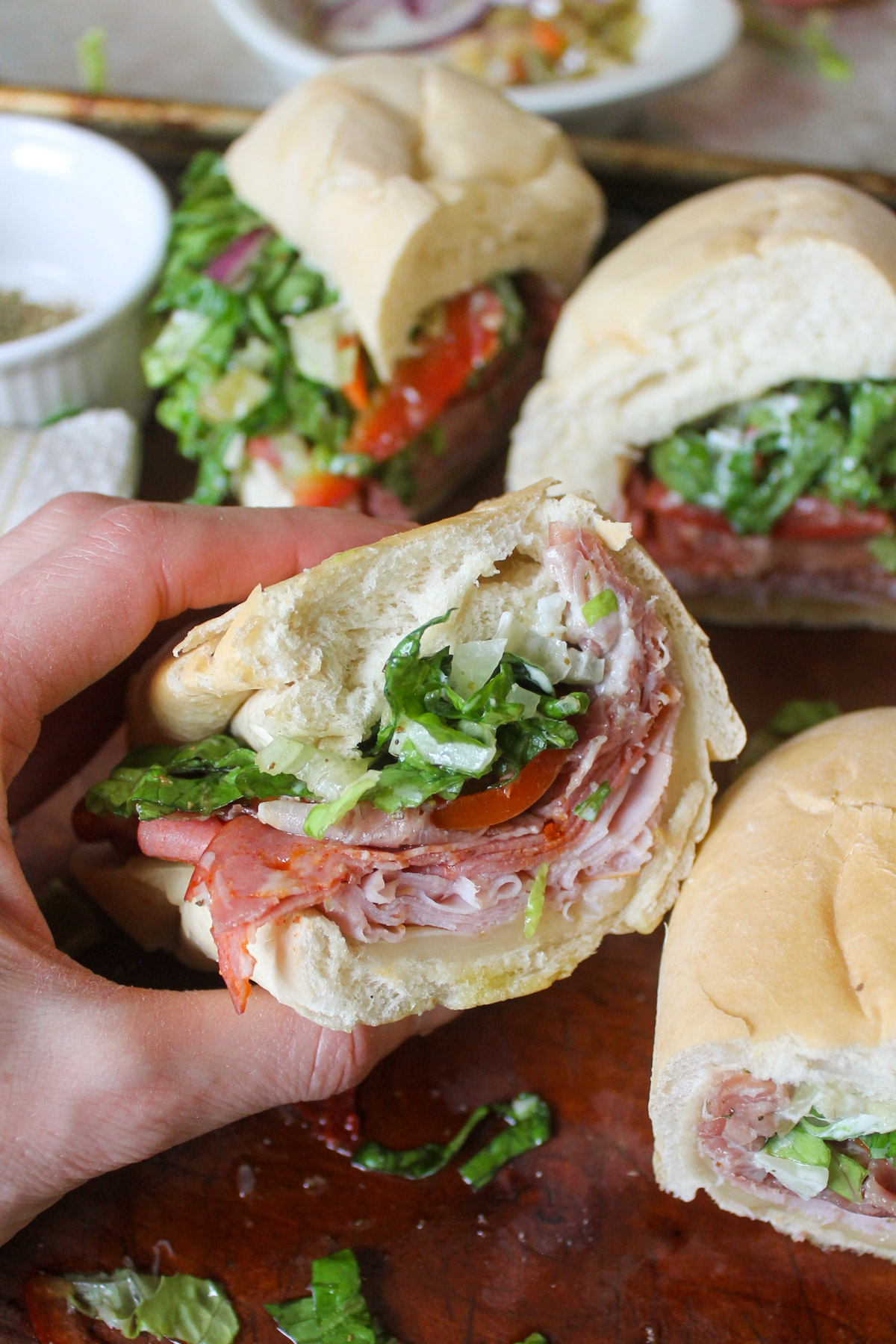 A sliced Grinder Sub Sandwich with deli meats.
