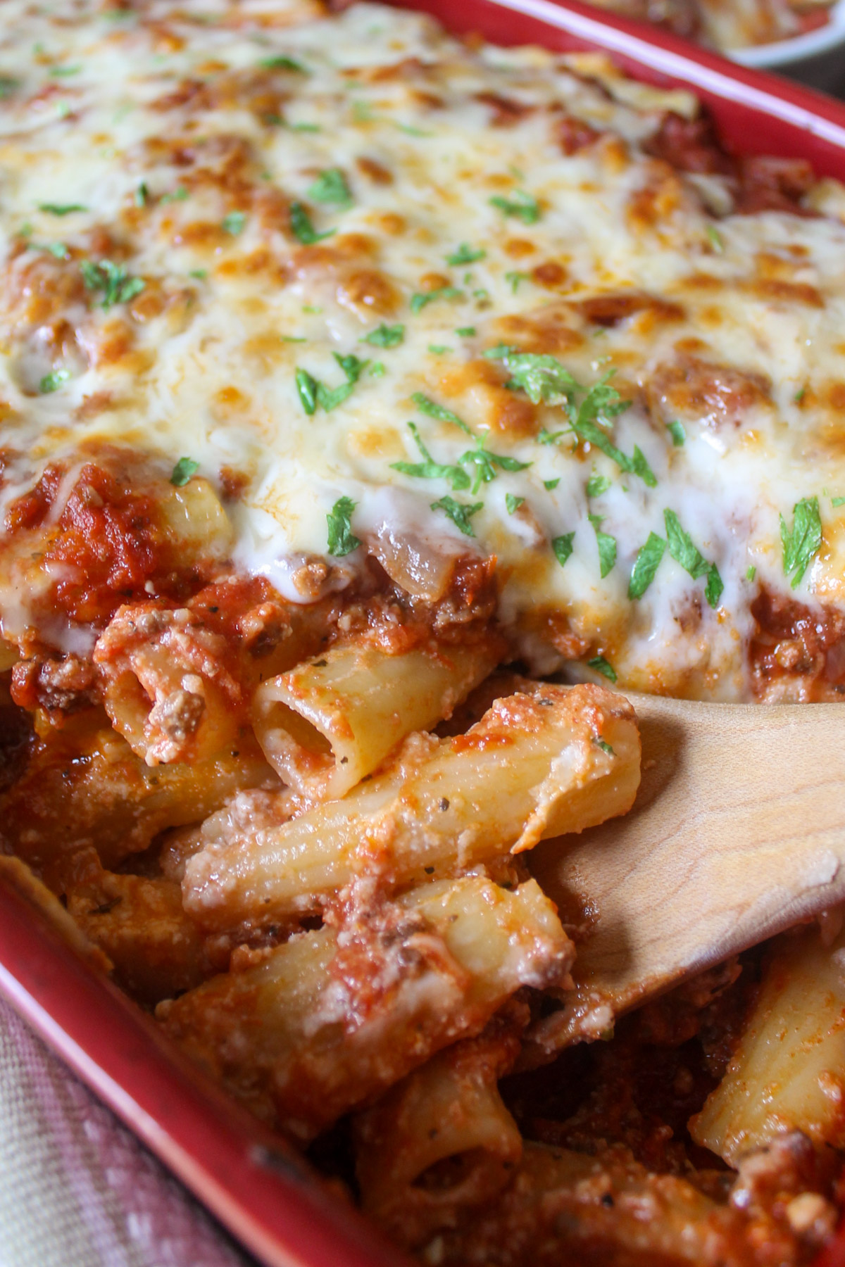 Rigatoni pasta noodles coated in ricotta cheese with marinara meat sauce.