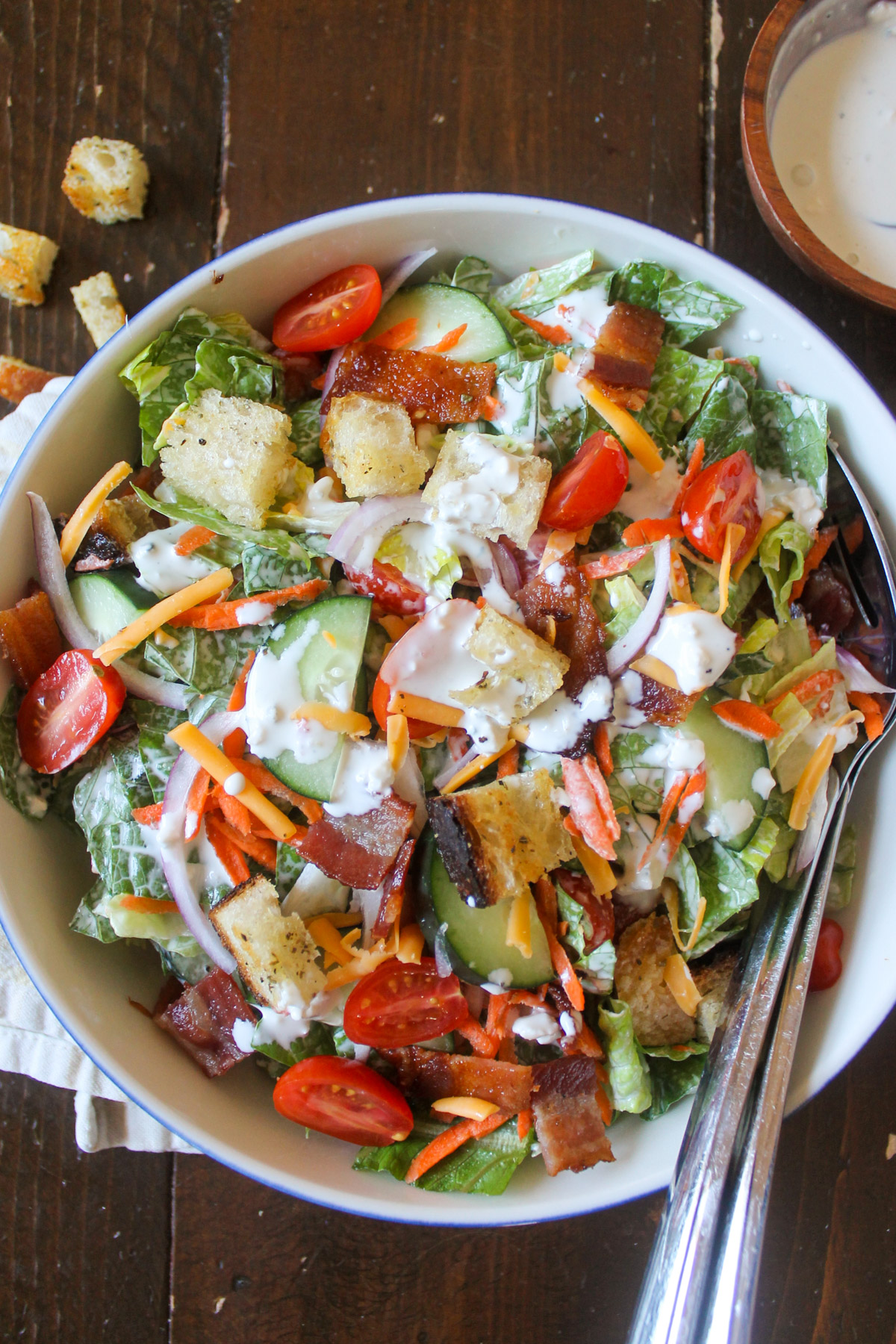 Steakhouse salad bar salad tossed with blue cheese dressing.