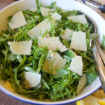 Arugula Salad with lemon vinaigrette and big pieces of Parmesan cheese.