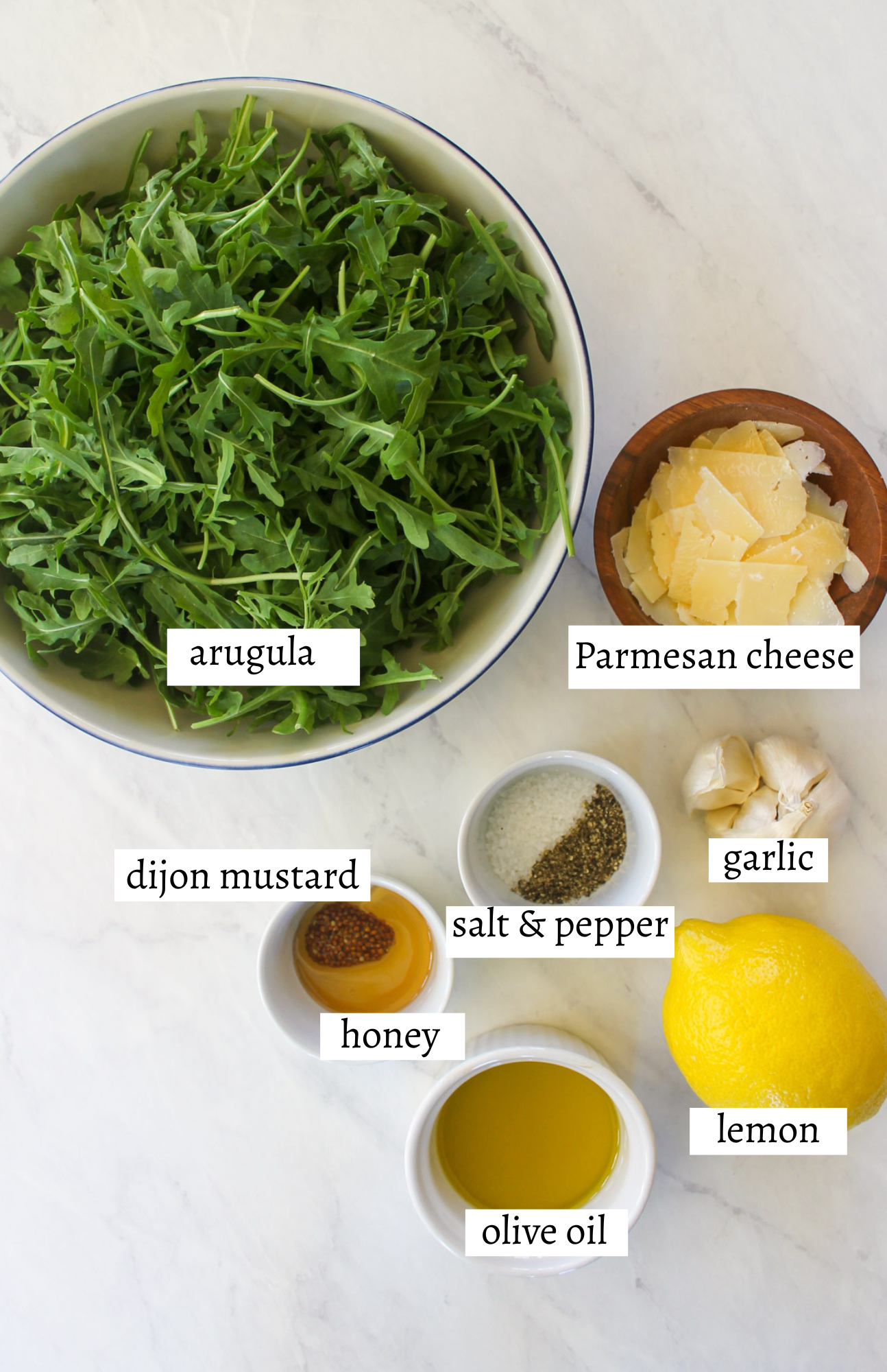 Labeled ingredients for Arugula Salad with Lemon Vinaigrette.