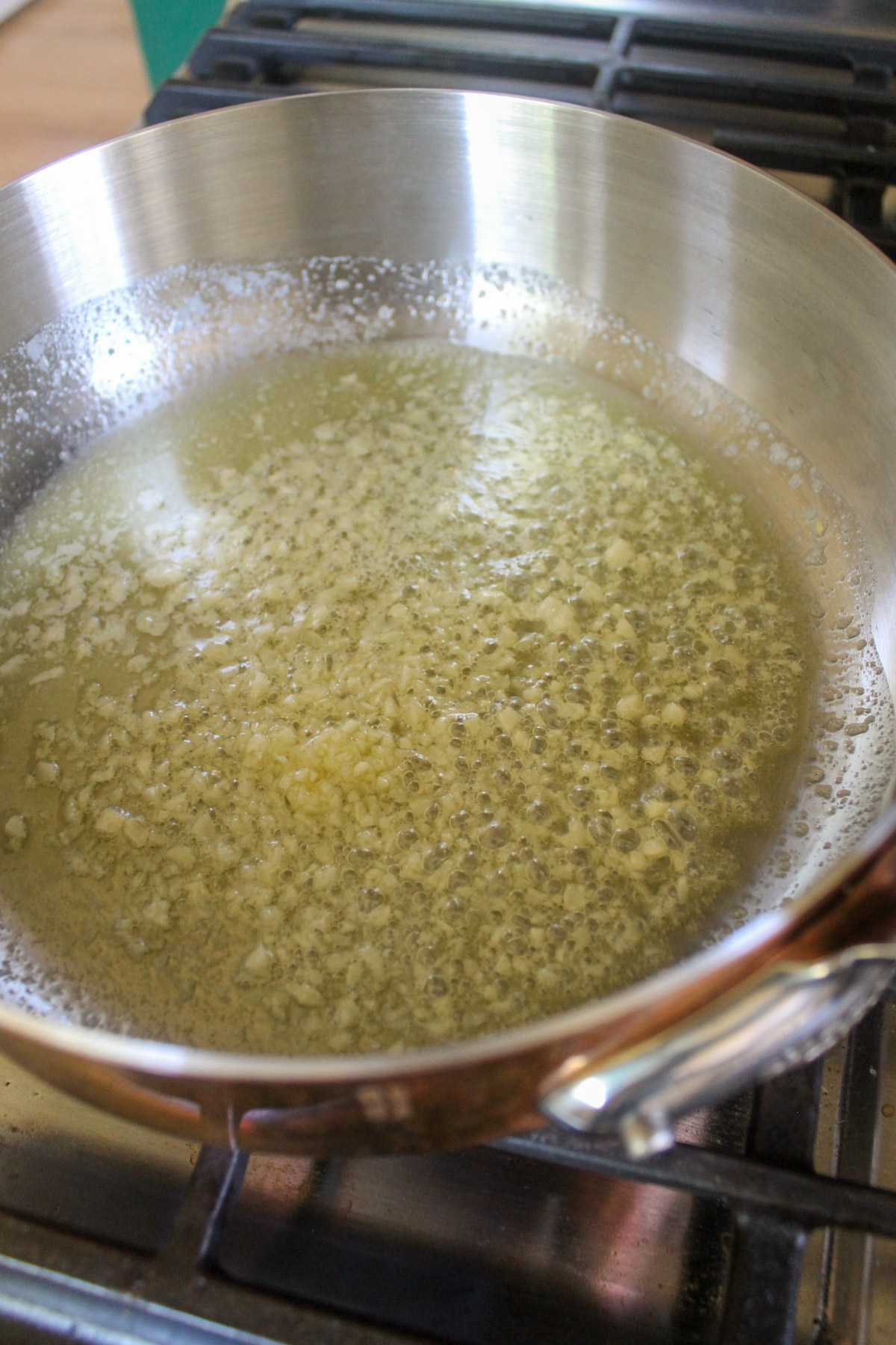 Garlic and butter cooking in a skillet to start Alfredo sauce.