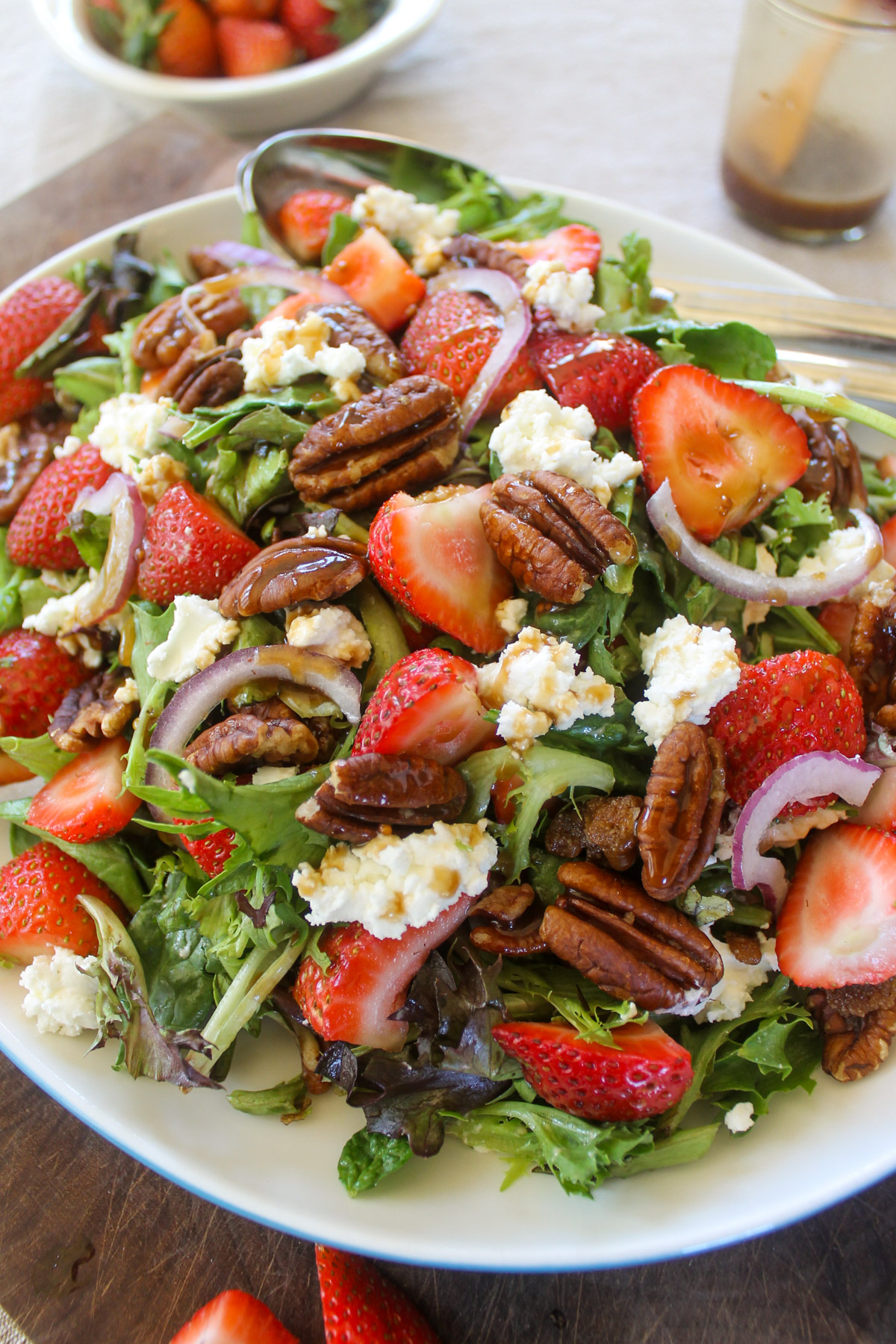 Strawberry Goat Cheese Salad on a bed of lettuce.