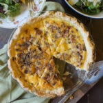 A quiche with cheese and bacon.