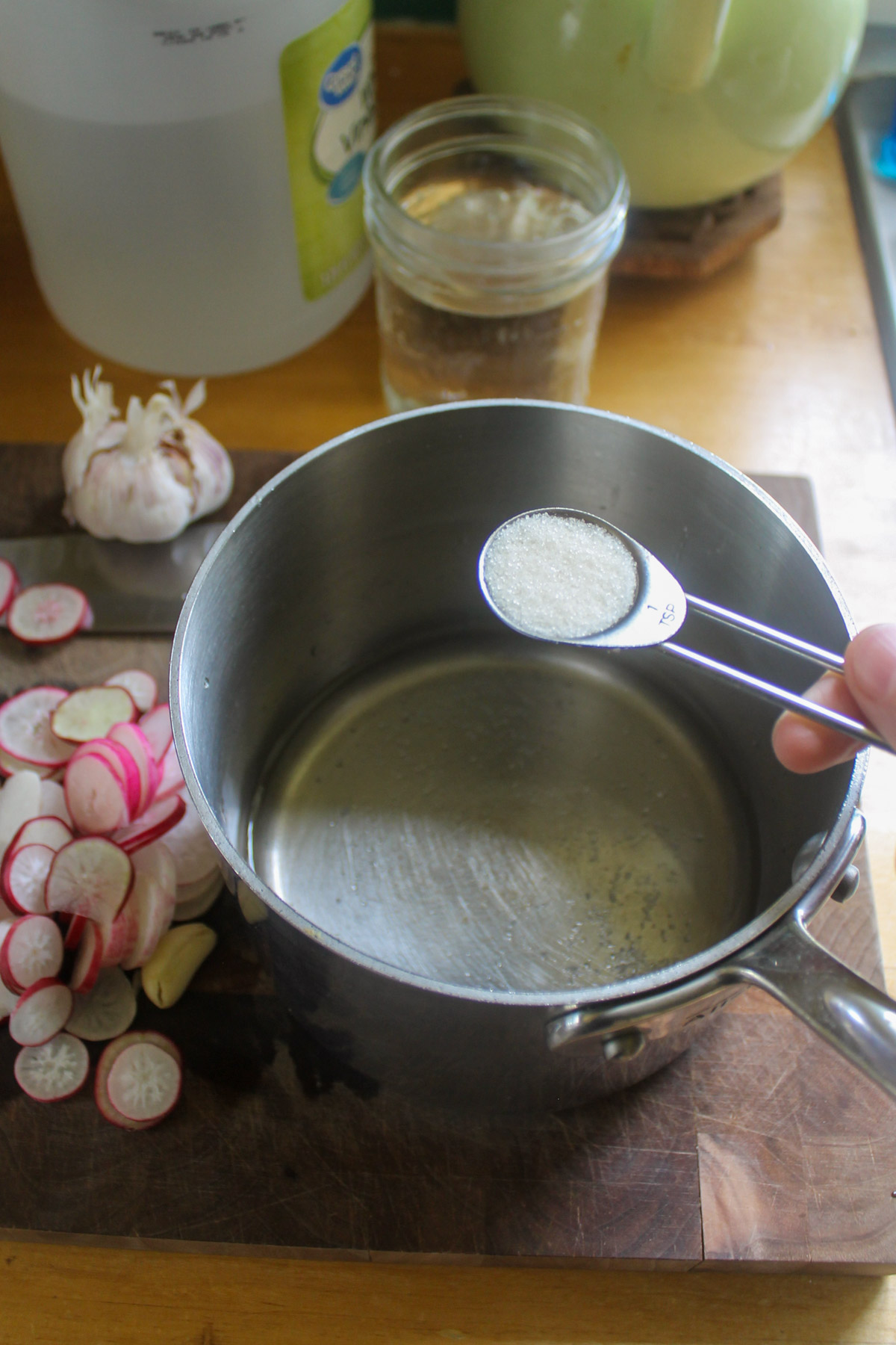 Making the brine for pickled radishes.