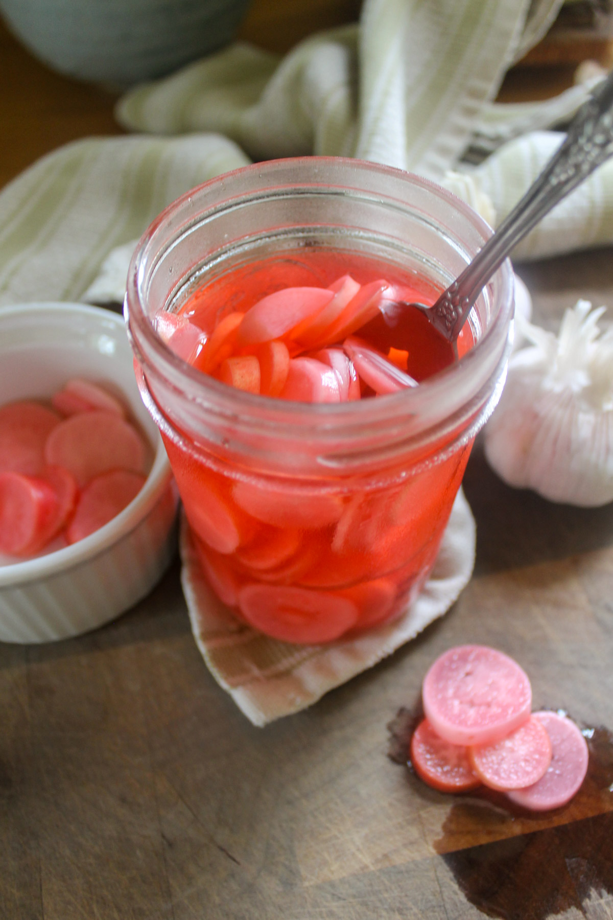 A jar of sliced pickled radishes.